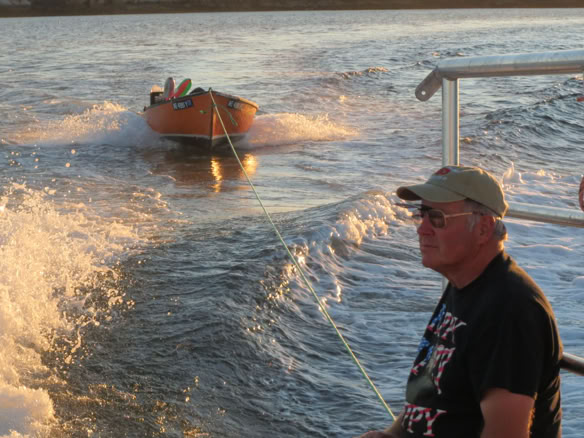 Lobsterman Paul Joy relaxing on a lobster boat under way to Marshall Island, Maine